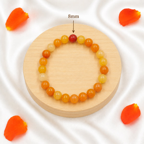 Detail of the 8mm genuine Carnelian gemstone beads on a handcrafted spiritual healing bracelet.
