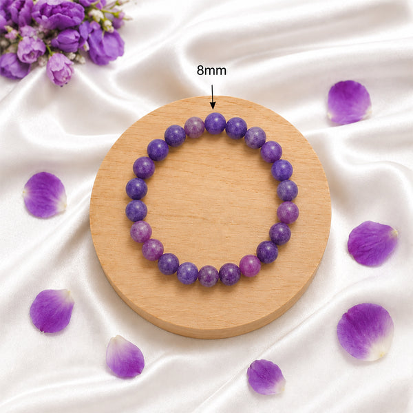 Detail of the 8mm genuine Lepidolite gemstone beads on a handcrafted spiritual healing bracelet.