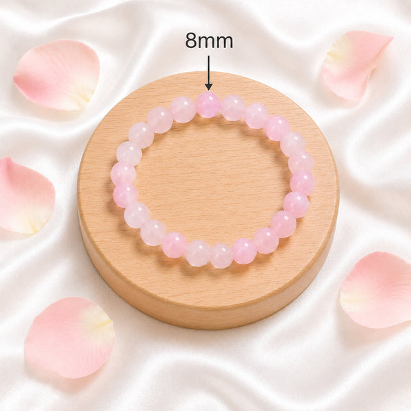 Detail of the 8mm genuine Rose Quartz gemstone beads on a handcrafted spiritual healing bracelet.