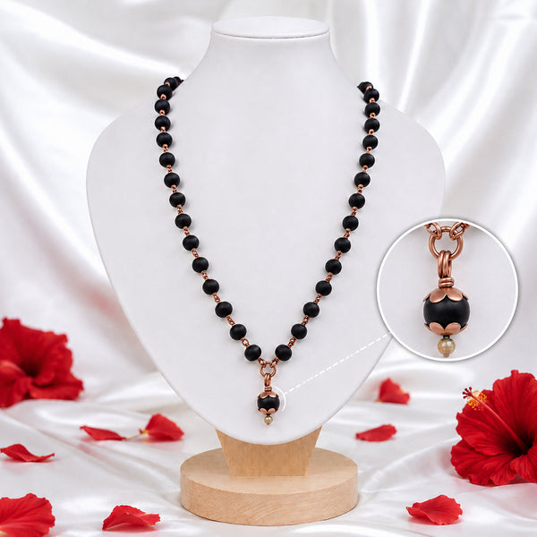 Close-Up of Natural Karungali Wood Beads with Copper Finish Connectors on Karungali Mala Necklace