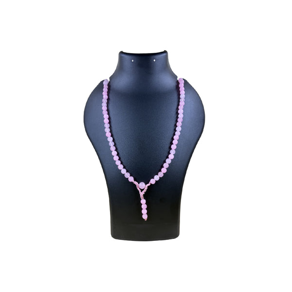 Pink beaded necklace on a black mannequin bust against a white background