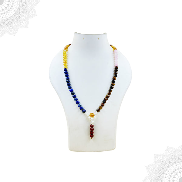 Multi-colored 7 Chakra mala prayer beads for yoga and meditation on a white background with spiritual mandala decorations.
