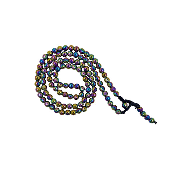 A strand of Titanium Aura prayer beads coiled in a spiral on a white background, showcasing the vibrant iridescent metallic colors of the polished beads.