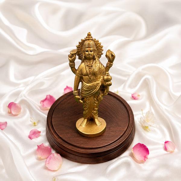Top-down angled view of Lord Dhanvantri Ayurveda idol showing intricate resin details.