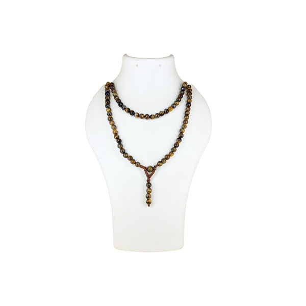 A Tiger's Eye crystal mala necklace worn doubled over a white jewelry mannequin bust to show the length and earthy color variations.