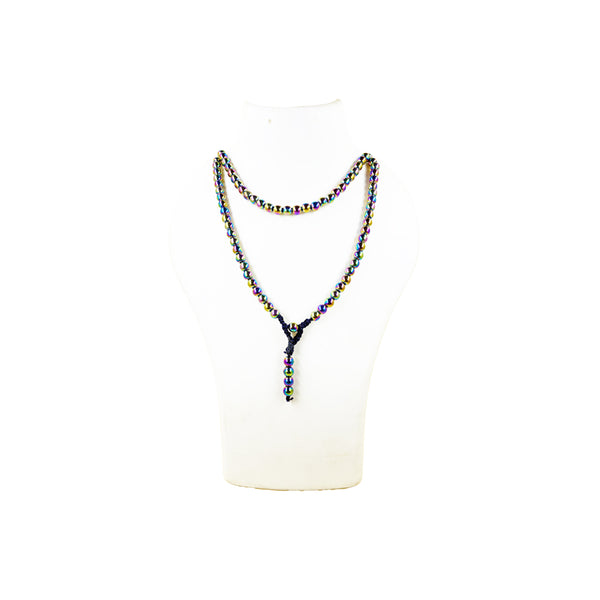 A long Titanium Aura crystal mala necklace with rainbow iridescent metallic beads, worn doubled over a white jewelry mannequin bust.