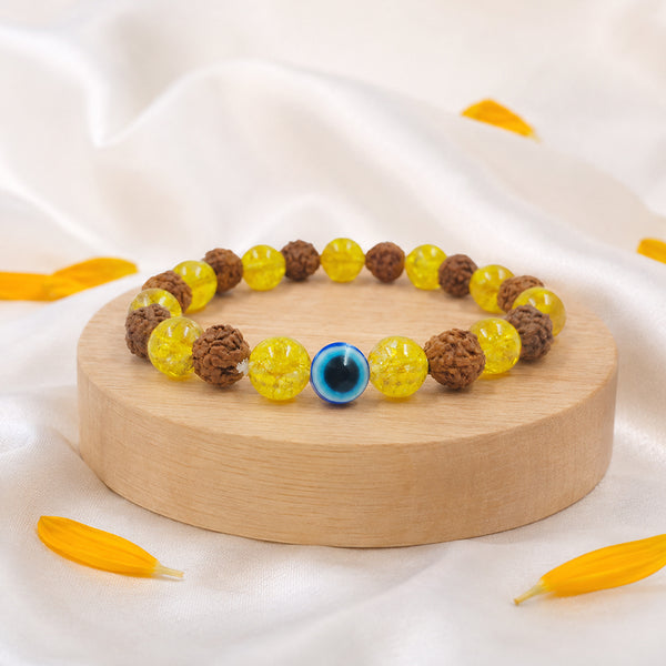 Handcrafted protection bracelet featuring 5 Mukhi Rudraksha, Yellow Citrine beads, and a central Blue Evil Eye to ward off negative energy.