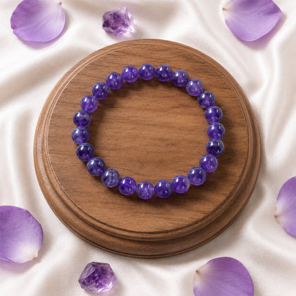 A person wearing the 8mm Amethyst bead bracelet to enhance intuition and crown chakra alignment