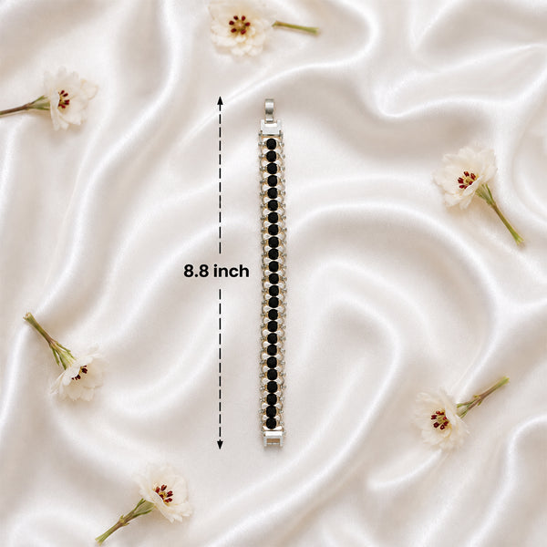 Full 8.8-inch length measurement of the architectural Karungali wood and white metal bracelet.