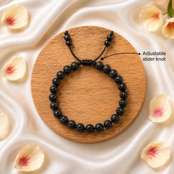 Close-up of the original karungali bracelet highlighting the adjustable slider knot for a perfect free-size fit.