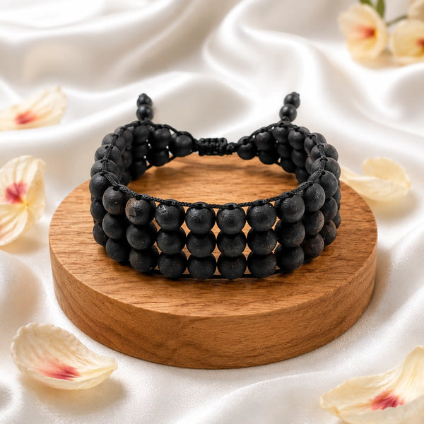 Triple row original karungali kattai bracelet made of authentic ebony wood beads on a luxury display.