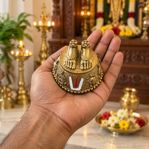 Palm-sized Perumal Patham with Namam held in hand showing its compact size