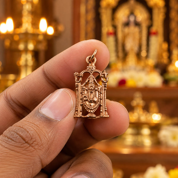 Small rose gold Perumal pendant with temple arch design, held in hand