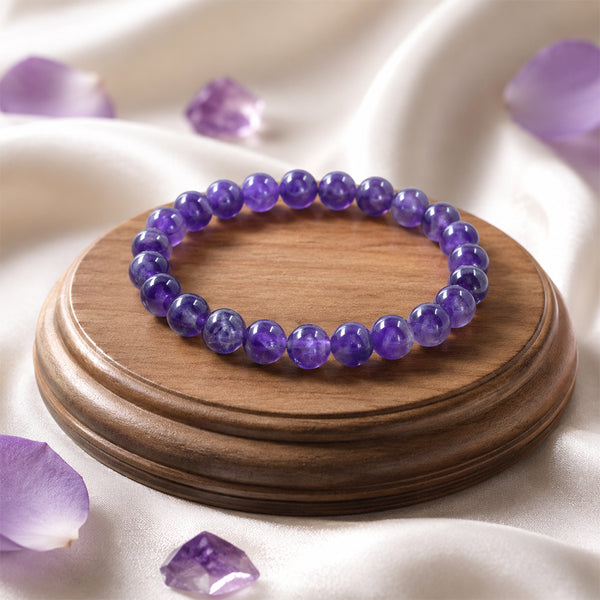 Premium Amethyst crystal bracelet on a wooden display, known as the stone of spirituality and anxiety relief
