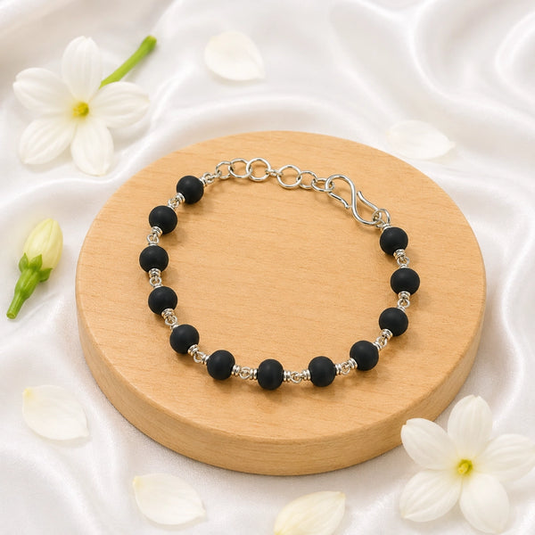Handcrafted Karungali (Ebony Wood) bracelet with intricate silver-toned wire wrapping and a secure S-hook clasp.