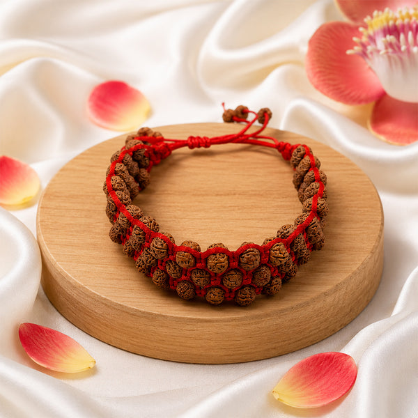 Premium triple layer Rudraksha bracelet handcrafted with three rows of authentic beads on a red spiritual cord.