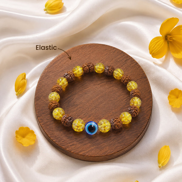 Detailed view of the high-durability elastic stretch cord on a genuine Rudraksha and Yellow Crystal protection bracelet.