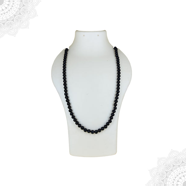 A full-length Black Tourmaline crystal mala necklace displayed as a single strand on a white mannequin bust, highlighting the uniform black color and length of the protective strand.