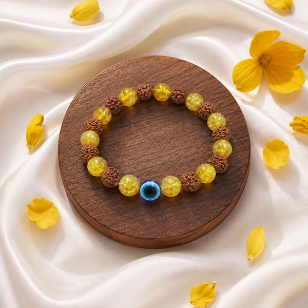 Side view of the 8mm Evil Eye removal bracelet with authentic Rudraksha seeds and prosperity-attracting yellow crystals on a luxury display.
