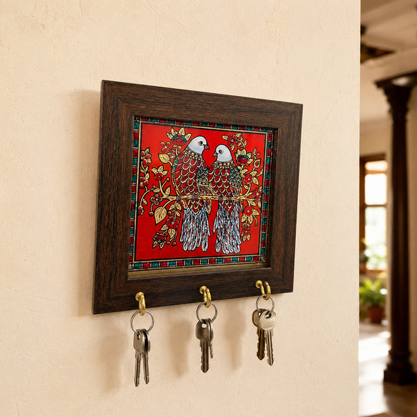 Close up of Tanjore key holder dove pair design with brass hooks