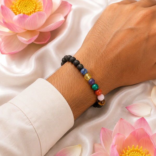 A person wearing the 7 Chakra Karungali ebony wood bracelet, showcasing its comfortable fit and vibrant crystal alignment.