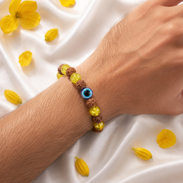 A person wearing the Evil Eye Rudraksha and Citrine bracelet on their wrist for daily luck and spiritual aura protection.